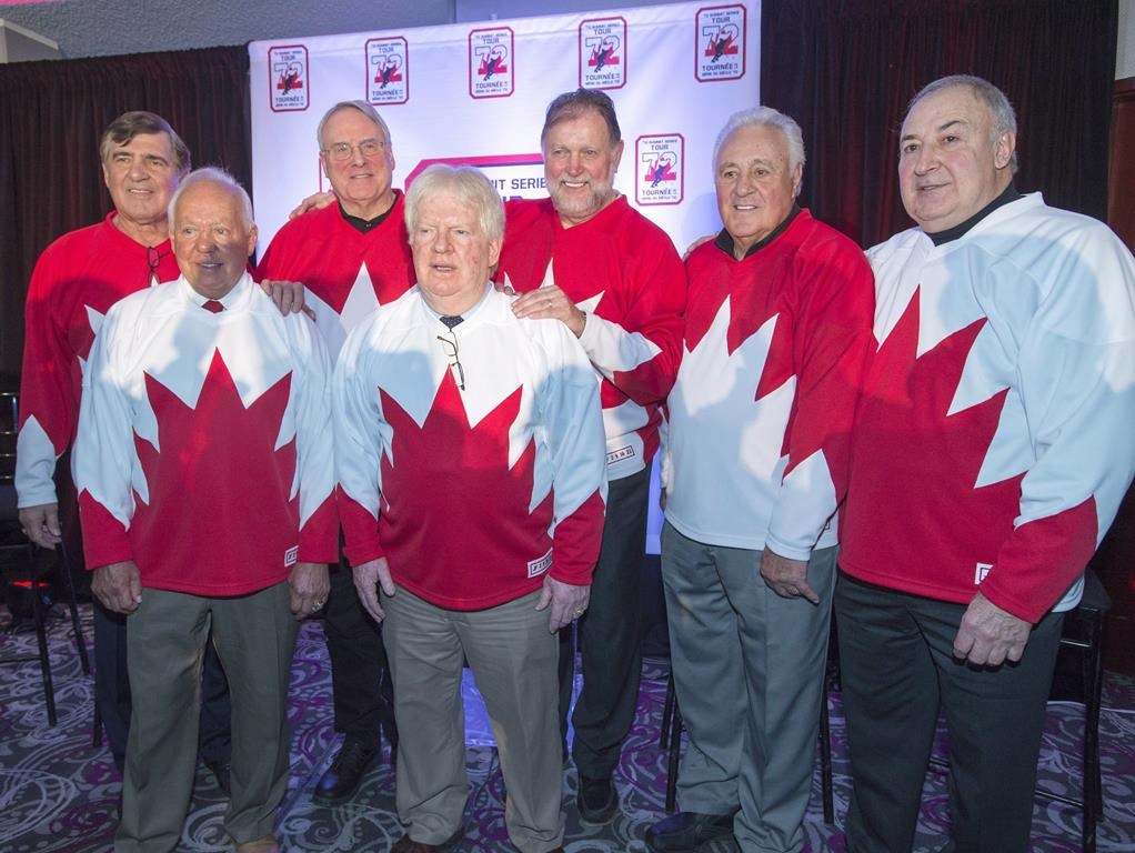 Team Canada 1972 players Serge Savard, left, Yvan Cournoyer, Ken Dryden, Pat Stapleton, Peter Mahovolich, Phil Esposito and Guy Lapointe, right, pose for photos at a news conference, in Montreal on Tuesday, Feb. 9, 2016. Pat Stapleton, a longtime NHL defenceman who famously kept an air of mystery over whether he had possession the puck from the goal that won the 1972 Summit Series, has died. He was 79. THE CANADIAN PRESS/Ryan Remiorz.