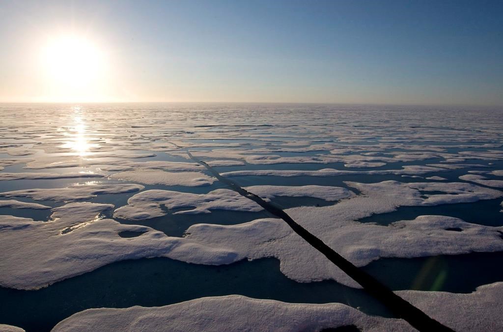 The midnight sun shines over the ice-covered waters near Resolute Bay at 1:30 a.m. as seen from the Canadian Coast Guard icebreaker Louis S. St-Laurent on Saturday, July 12, 2008.