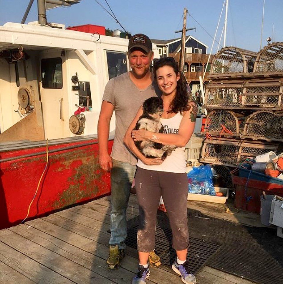 Jaime Wertman and her husband, lobster fisherman Justin Stewart, stand by their boat in Eastern Passage.