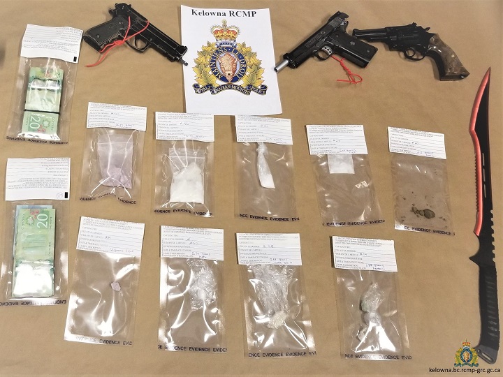 A photo showing weapons, drugs and money seized during a search warrant that was executed in Kelowna on Thursday, April 16, 2020.