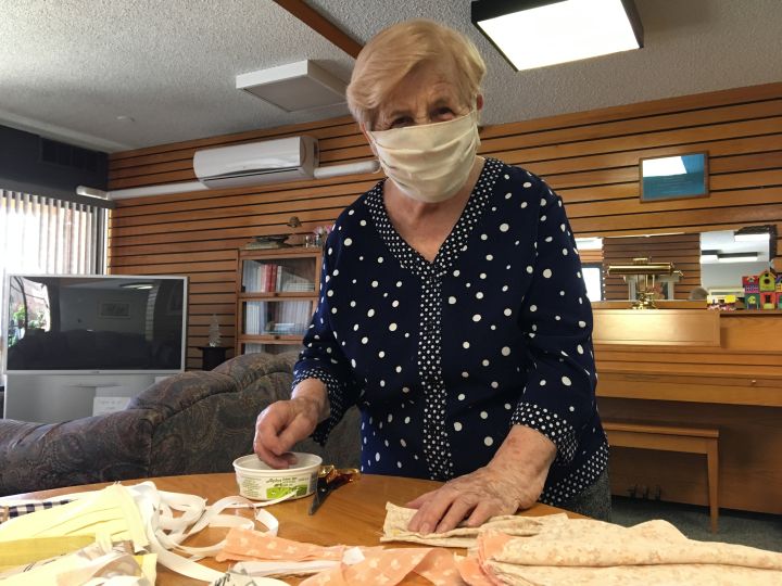 Maria Gal with some of the more than 400 protective masks she's sewn during the COVID-19 pandemic.