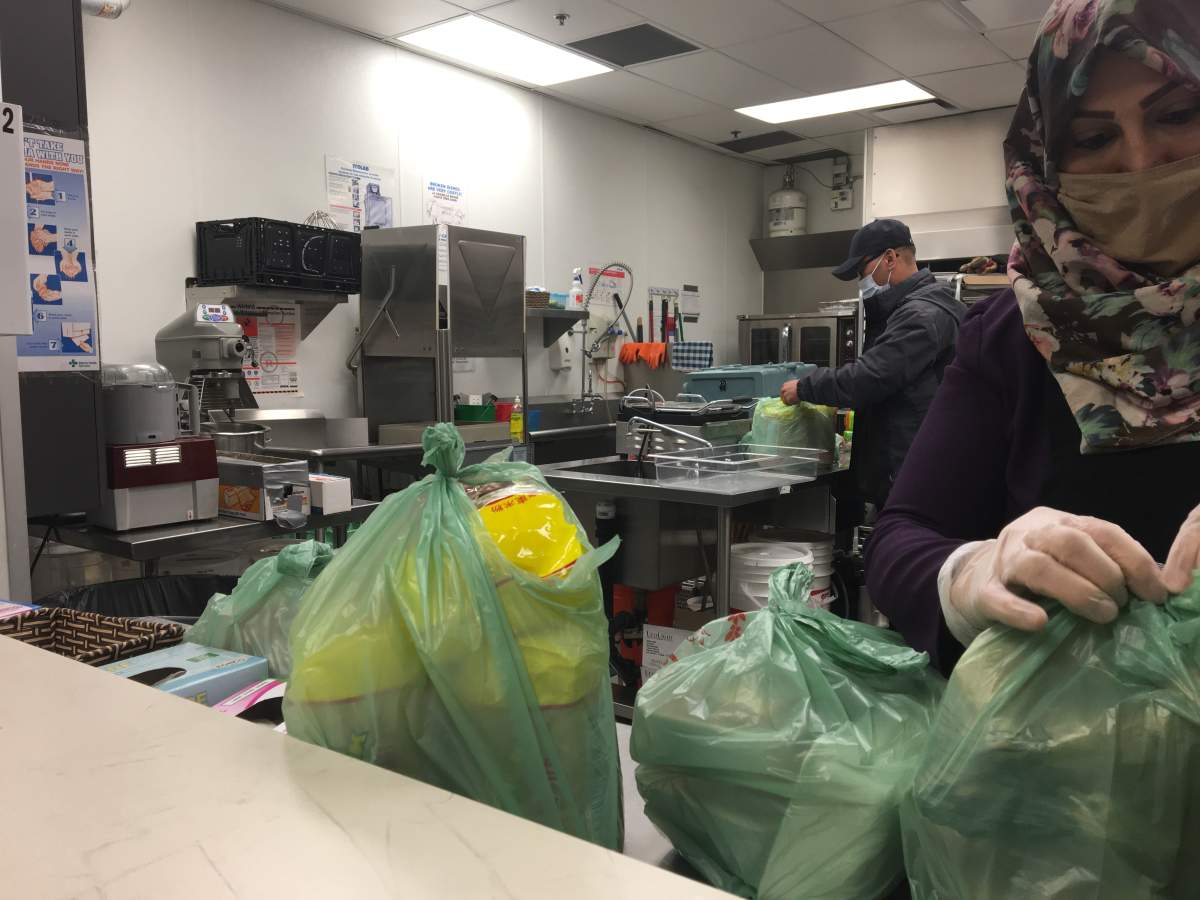 Preparing food hampers for community.