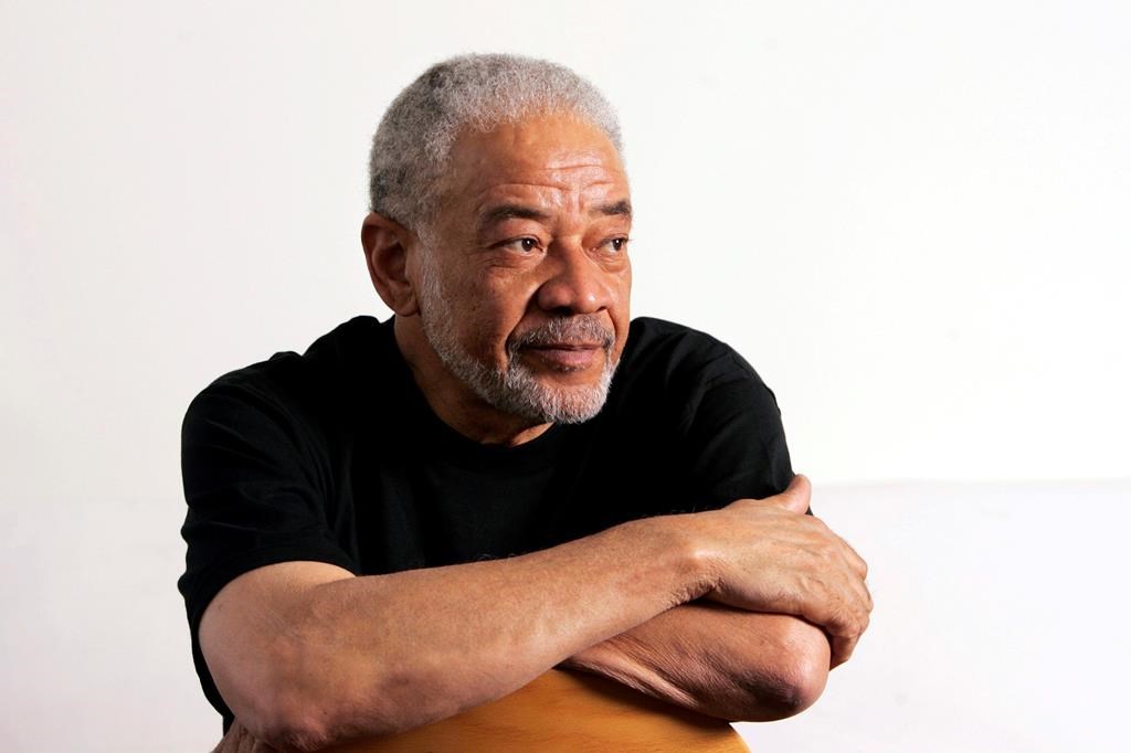 In this June 21, 2006 file photo, singer-songwriter Bill Withers poses in his office in Beverly Hills, Calif. (AP Photo/Reed Saxon, File)