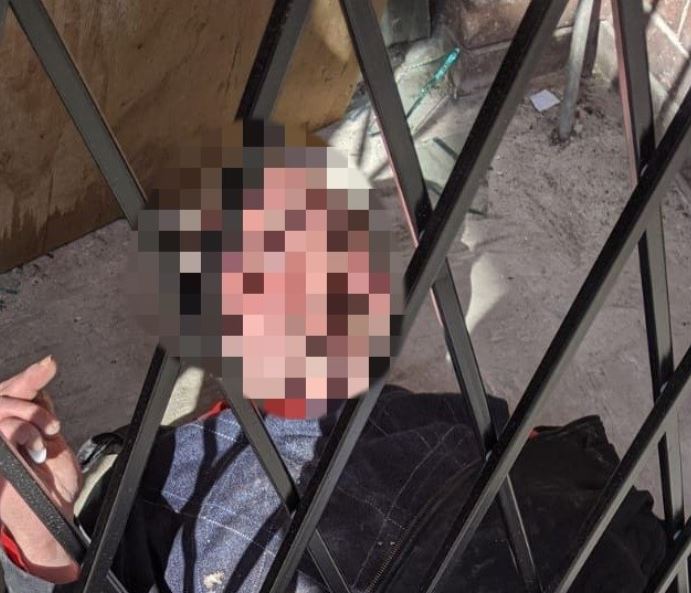 Vancouver police tweeted out this photo of the man trapped in the security gate. His face is blurred because he was not charged with any crime.