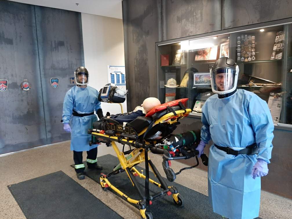 A pair of Hamilton paramedics who are part of an infectious disease team dawn powered air purifying respirators as part of personal protection equipment the 12 member group will wear when caring for patients connected to the new coronavirus.