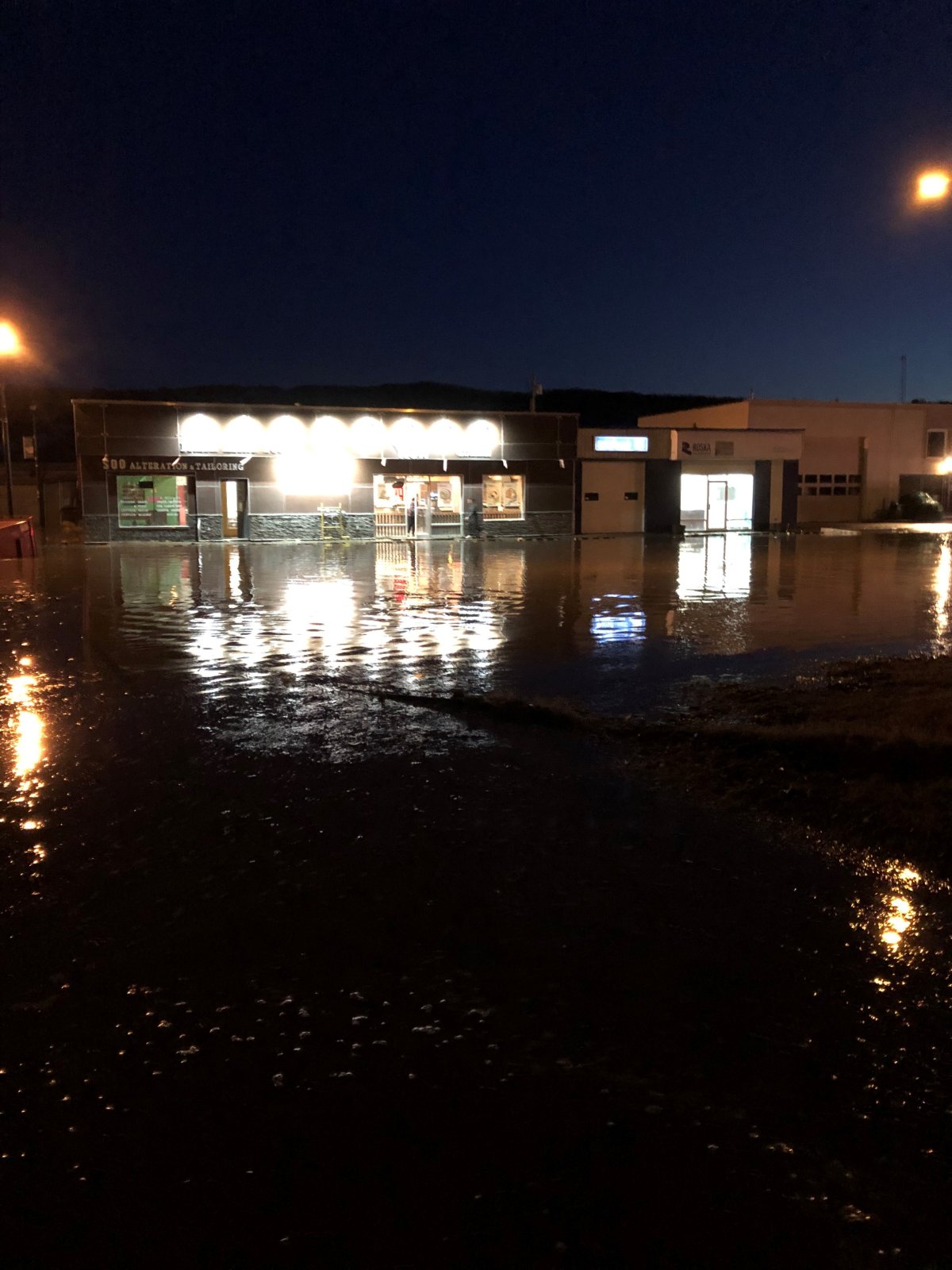 A street in downtown Peace River is shown flooded Saturday evening. 