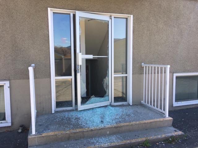 This rear door at the Fairlane apartment complex in Penticton shows the aftermath of what police say looks like damage from gunfire. 