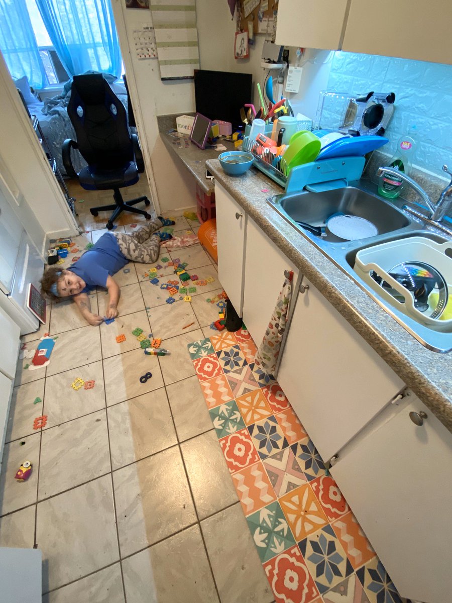 Phoenix plays with toys on the kitchen floor. Photo courtesy of Susan Cosgrove