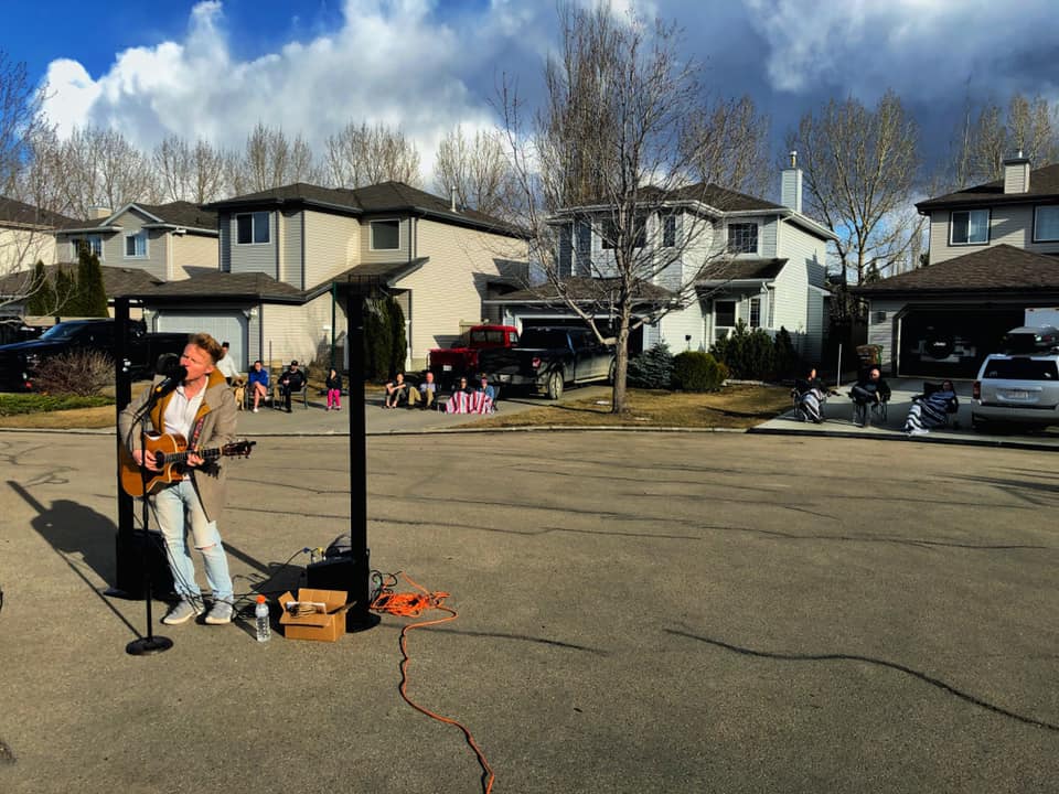 Martin Kerr performs in a cul-de-sac in Edmonton during the pandemic.