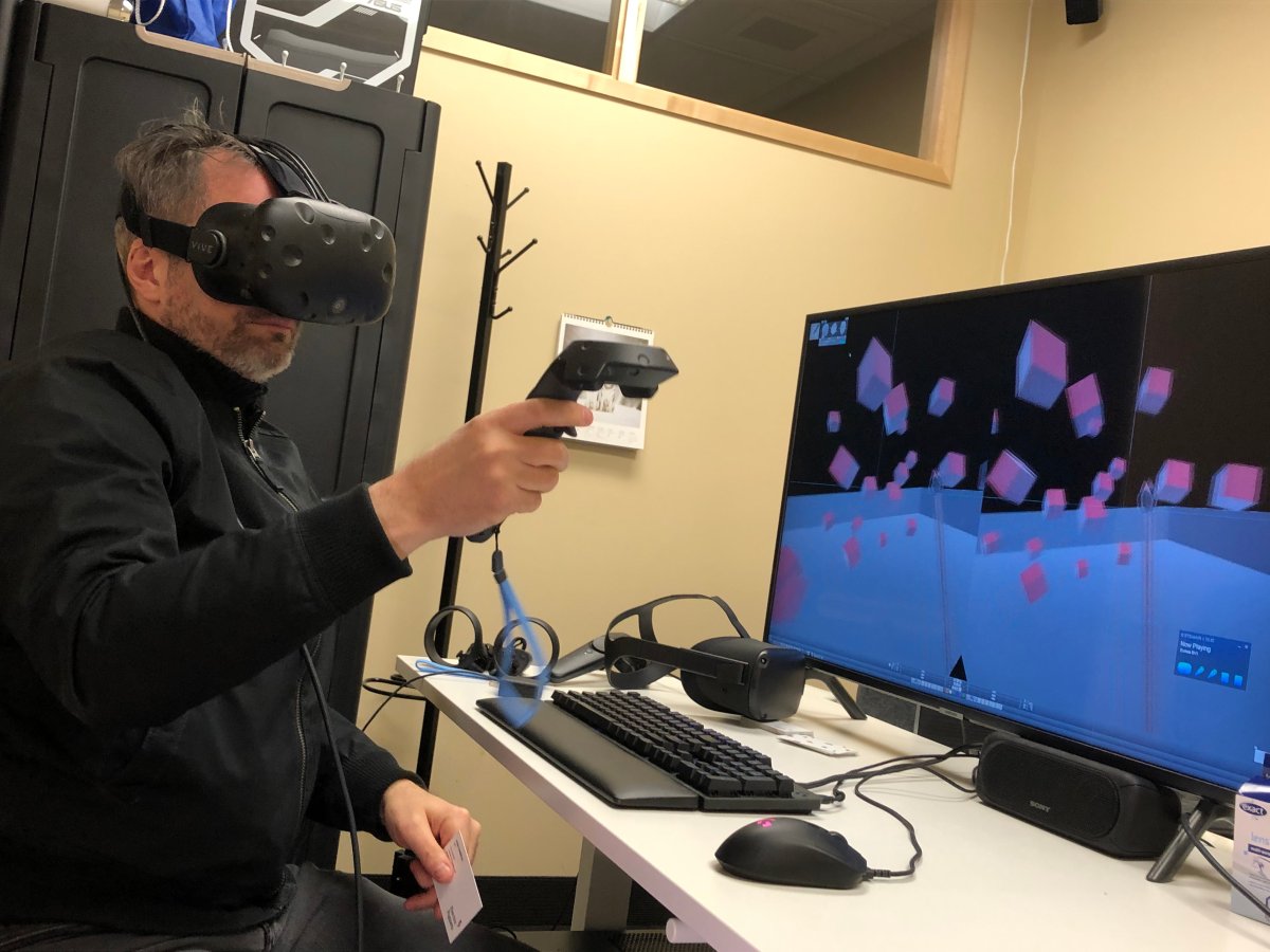 Ryan Cameron, CEO and founder of Electric Puppets, demonstrates his virtual reality software at the office in Halifax on April 7, 2020.