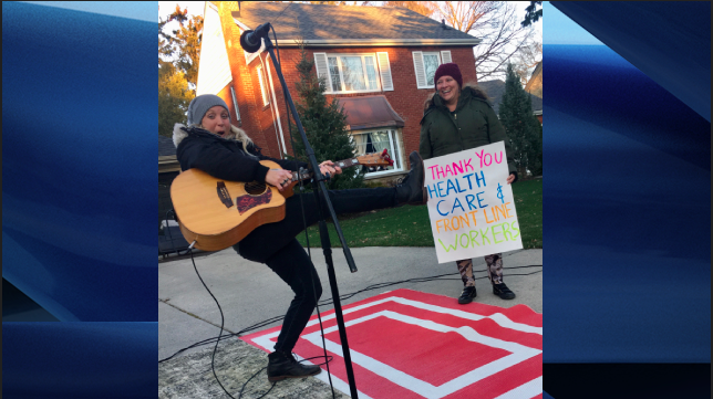 Two residents of Wortley Village jam out as the community thank frontline and healthcare workers amid the COVID-19 pandemic. 