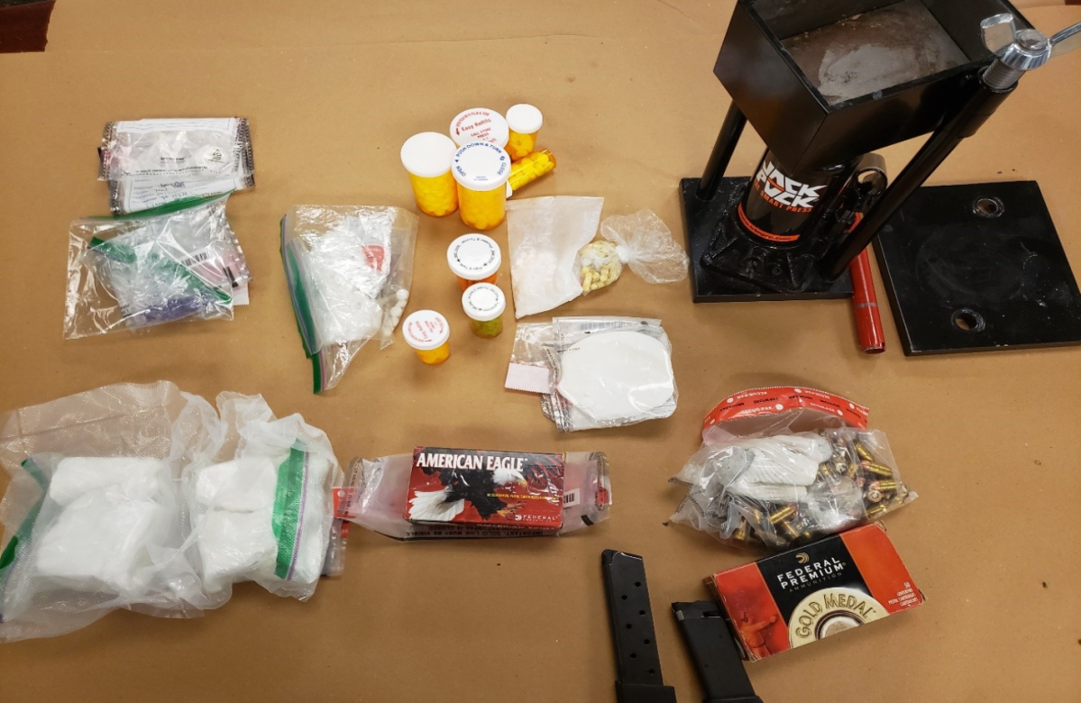 Four London men are facing a combined 70 charges after London Police Service seized two loaded guns and $77,000 worth of drugs.