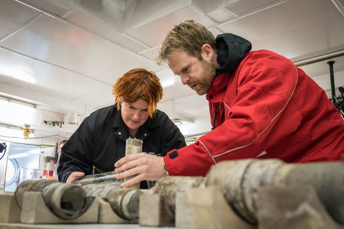 Johann Klages, right, and Tina van de Flierdt look at sediment samples harvested from the ocean floor near the South Pole.
