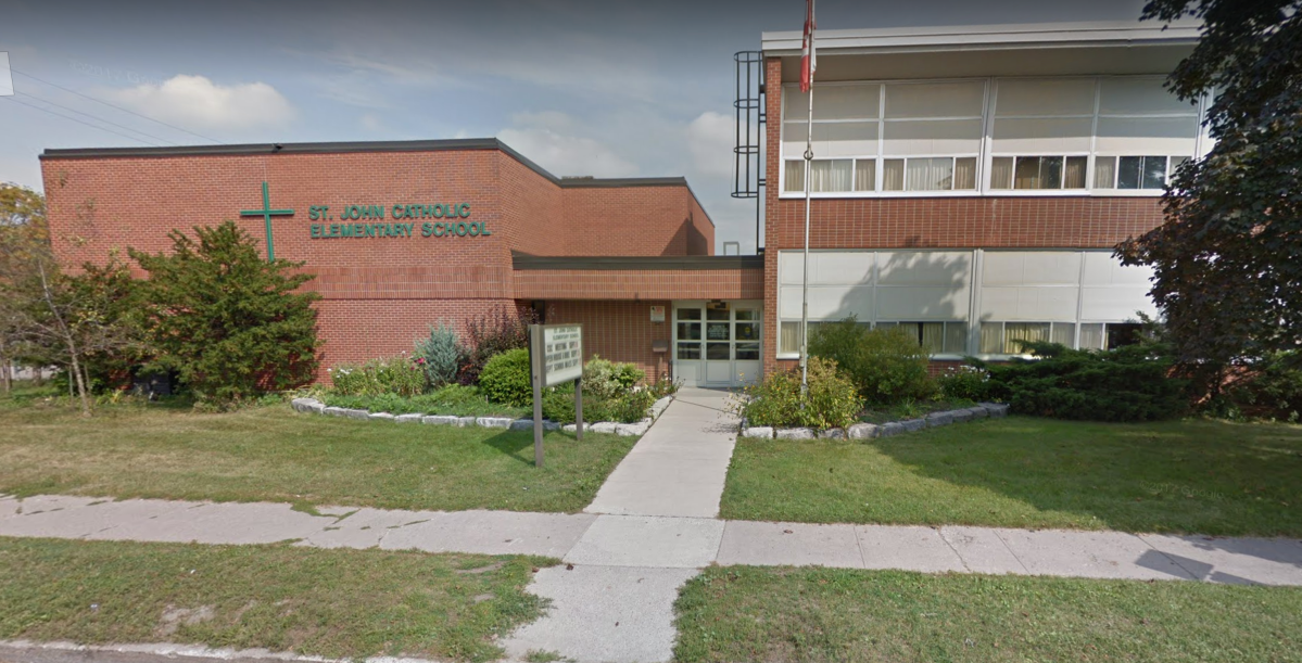 Peterborough police are investigating after they say derogatory slurs were found spray-painted on property at St. John Catholic Elementary School.
