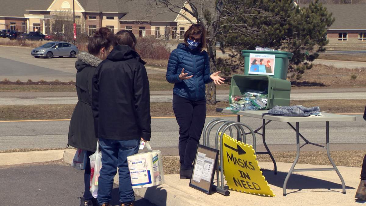 Cathy Connolly explains the group to shoppers as they leave the store