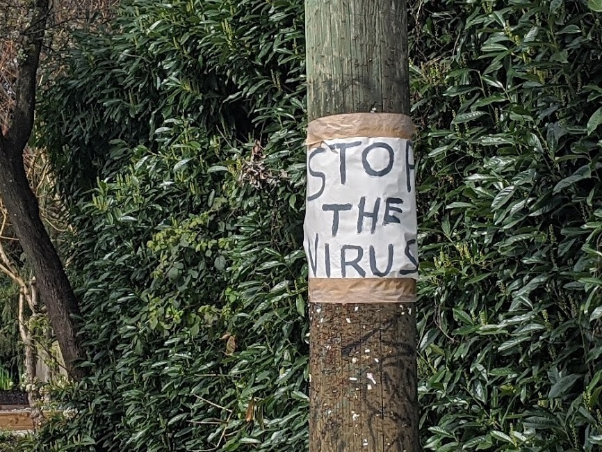 A handmade sign seen in Vancouver's Strathcona neighbourhood during the COVID-19 pandemic. 