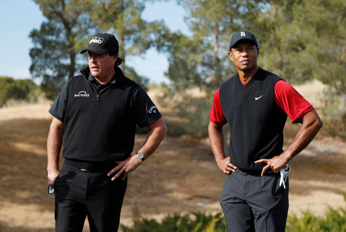 Phil Mickelson, left, and Tiger Woods stand at the first tee before a golf match at Shadow Creek golf course, Friday, Nov. 23, 2018, in Las Vegas.