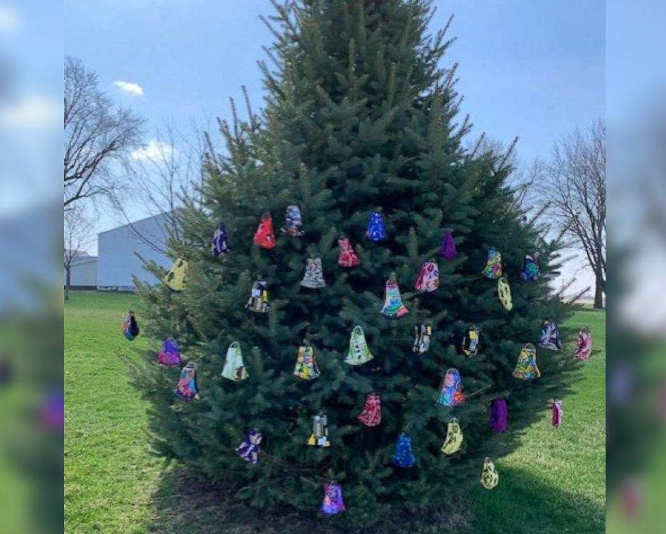 An Iowa woman has started sewing cloth masks for her neighbourhood, and hanging them on a tree for taking.