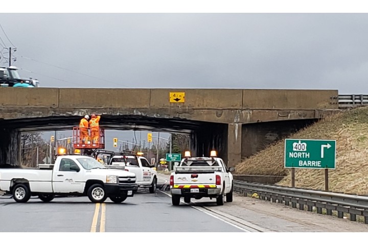 Officers say they were called to Innisfil Beach Road and Highway 400 on Monday afternoon for a report of a truck hitting a bridge.