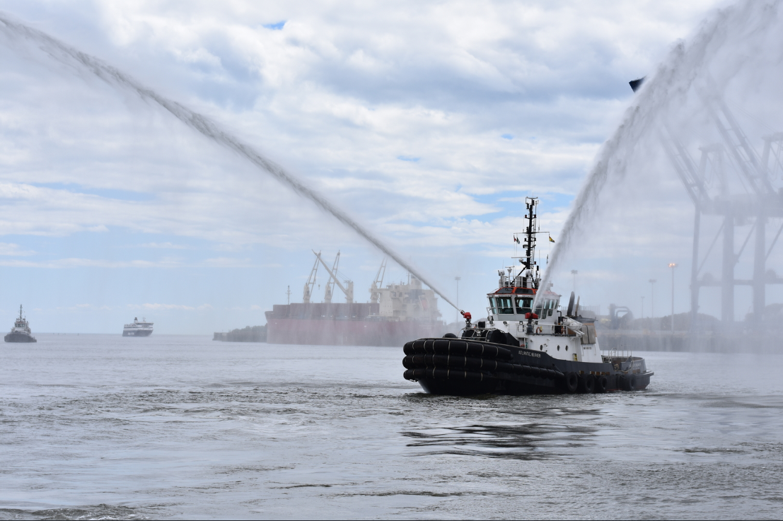 Atlantic Towing tug in a water display.