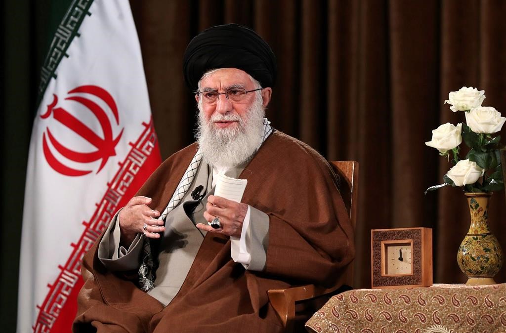 In this picture released by the official website of the office of the Iranian supreme leader, Supreme Leader Ayatollah Ali Khamenei addresses the nation on a televised speech, in Tehran, Iran, Sunday, March 22, 2020. Iran’s supreme leader Sunday refused U.S. assistance to fight the new coronavirus, citing an unfounded conspiracy theory that the virus could be man-made by America. (Office of the Iranian Supreme Leader via AP)