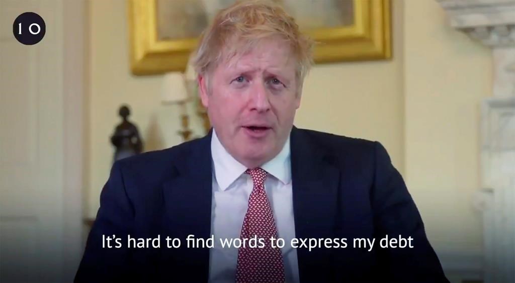 A screenshot from the Twitter page of Britain’s Prime Minister Boris Johnson, broadcast with text overlay, in which he hails the staff in the National Health Service (NHS) for saving his life, filmed at 10 Downing Street, London, Sunday, April 12, 2020. (Twitter Boris Johnson/Downing Street via AP)