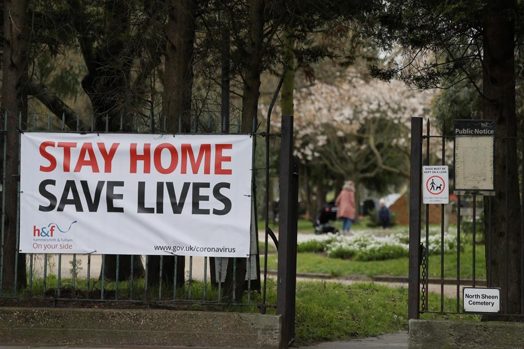 A large sign at the entrance to a park asking people to stay at home to help stop the spread of the coronavirus in London, Wednesday, April 1, 2020.