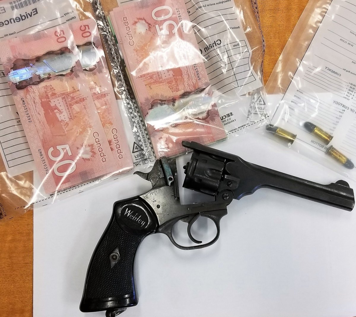 City of Kawartha Lakes OPP charged two men after seizing a firearm and money.