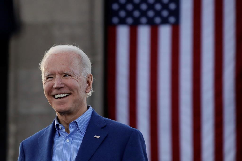 In this March 7, 2020, file photo Democratic presidential candidate former Vice President Joe Biden acknowledges the crowd during a campaign rally in Kansas City, Mo. Biden's campaign says the former vice-president will rip up President Donald Trump's approvals for the Keystone XL pipeline if he takes over the White House next year. THE CANADIAN-AP Photo/Charlie Riedel, File.