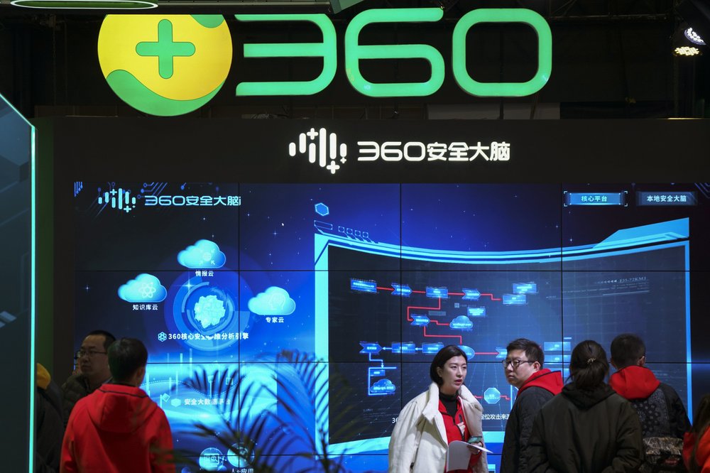 In this photo released by Xinhua News Agency, visitors tour the Chinese internet security firm Qihoo 360 showcasing it 5G digital security and protection system at the World 5G Convention in Beijing on Nov. 21, 2019. One of China's biggest tech companies has criticized the Trump administration for "politicizing business" after it slapped export sanctions on 33 more Chinese enterprises and government entities. 
