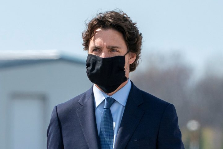 Canada's Prime Minister Justin Trudeau wears a protective face mask as he attends a repatriation ceremony for the six Canadian Forces personnel killed in a military helicopter crash in the Mediterranean amid the coronavirus pandemic at Canadian Forces Base in Trenton, Ont., May 6, 2020.