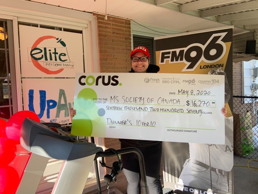 Andrea Dunn, known to FM96 listeners as Dunner, holds up a cheque for $16,270 following her 10-hour walk-a-thon in support of MS Society of Canada, May 8, 2020.