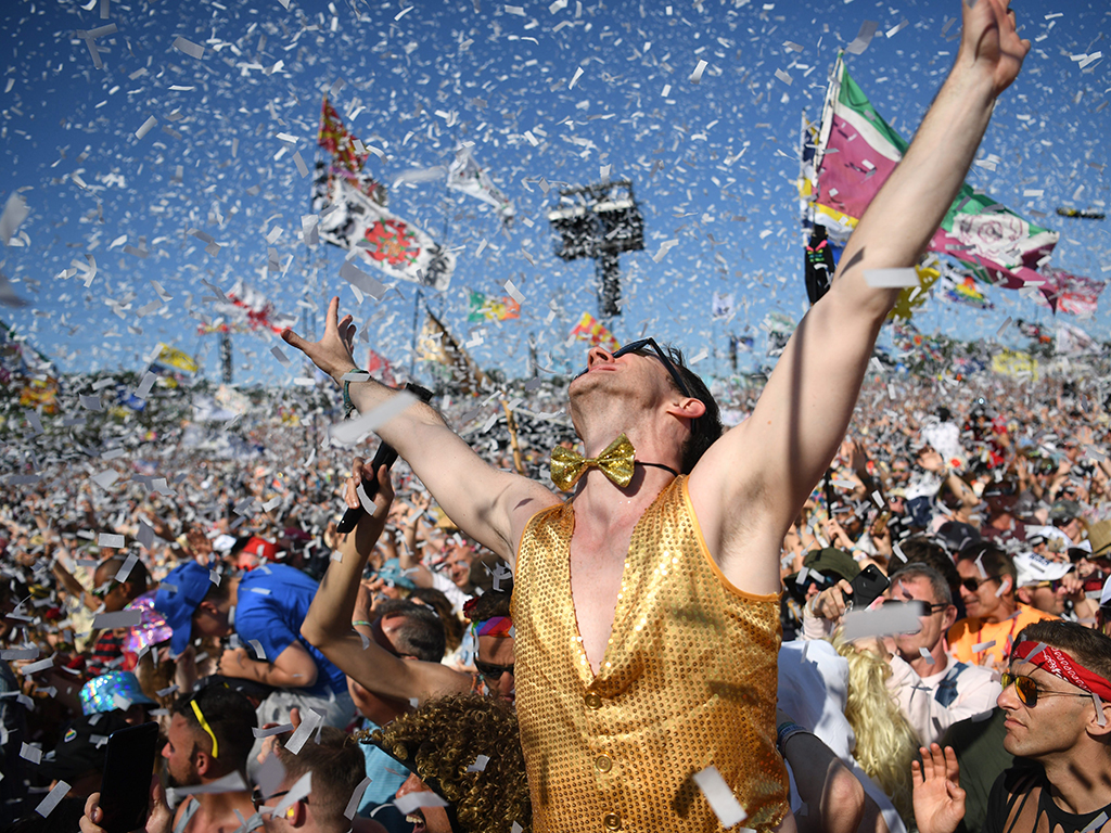 The crowd reacts as Australian singer Kylie Minogue performs on the Pyramid Stage on Day 5 of the Glastonbury Festival in Pilton, England on June 30, 2019.