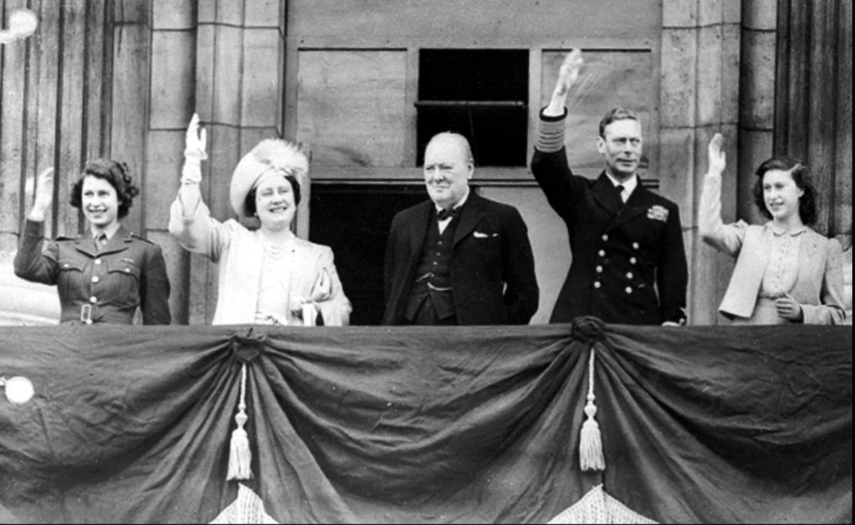 In this May 8, 1945 file photo Britain’s Prime Minister Winston Churchill, center, joins the royal family, from left, Princess Elizabeth, Queen Elizabeth, King George VI, and Princess Margaret, on the balcony of Buckingham Palace, London, England, on VE Day. Nazi commanders signed their surrender to Allied forces in a French schoolhouse 75 years ago this week, ending World War II in Europe and the Holocaust. Unlike the mass street celebrations that greeted this momentous news in 1945, surviving veterans are marking V-E Day this year in virus confinement, sharing memories with loved ones, instead of in the company of comrades on public parade.