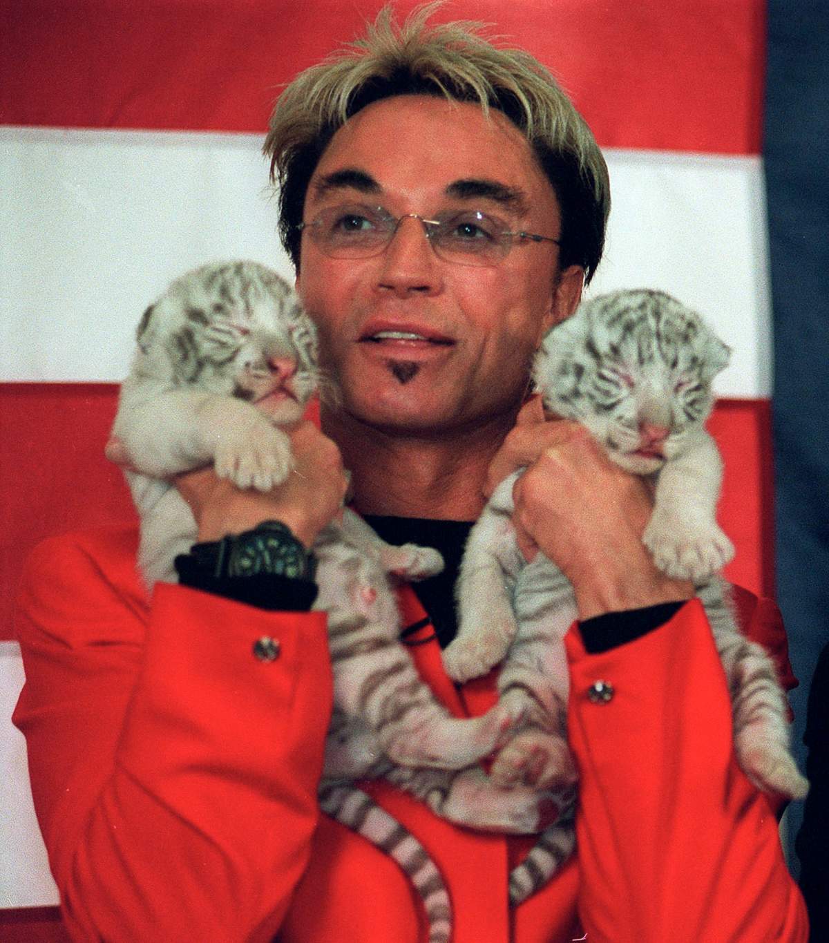 (FILE) – Roy Horn poses with two new tiger cubs at the Mirage in Las Vegas, Oct. 28, 2002.