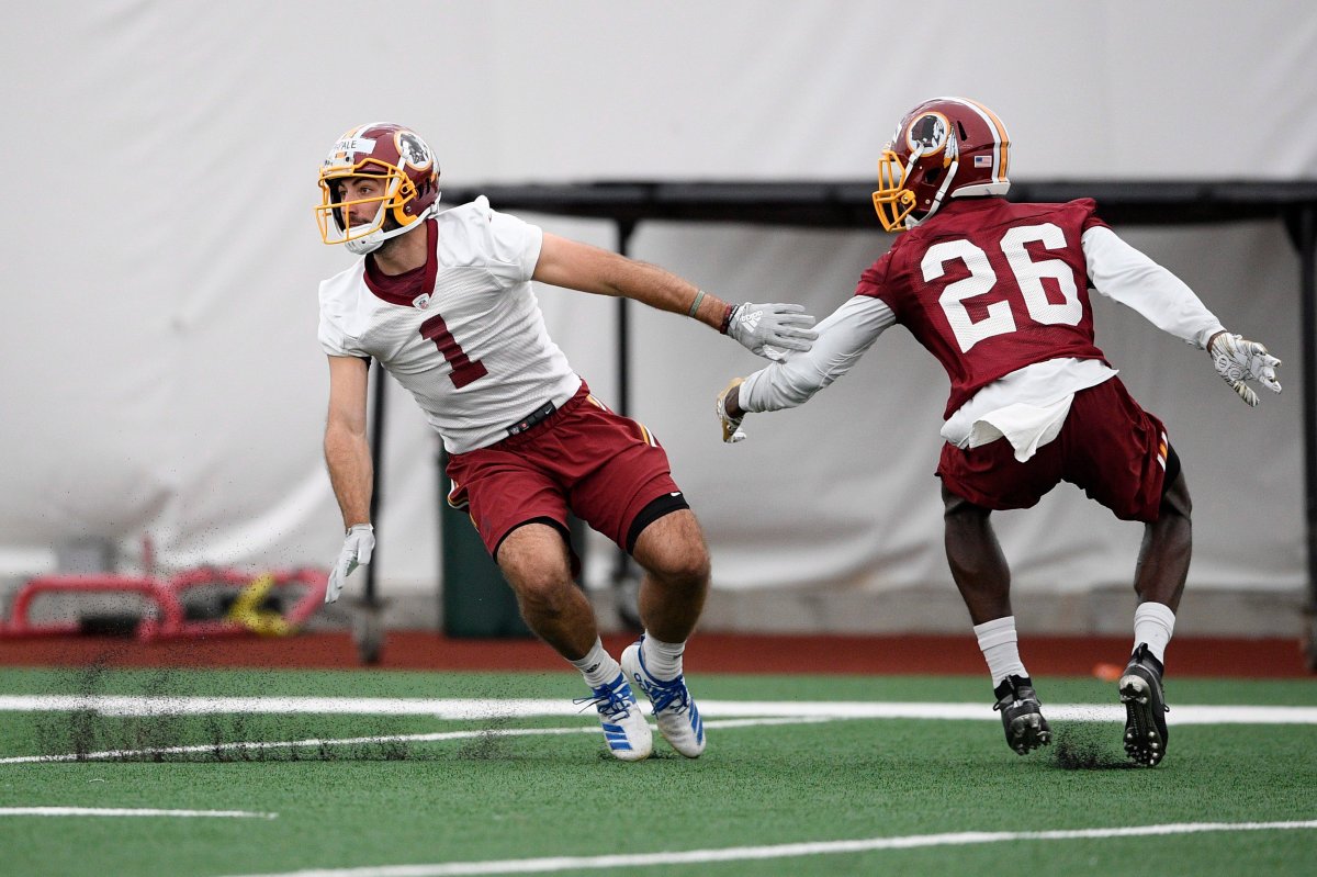Washington Redskins wide receiver Vinny Papale (1) runs a drill against cornerback Tyler Green (26) during an NFL football rookie camp, Saturday, May 11, 2019, in Ashburn, Va. 