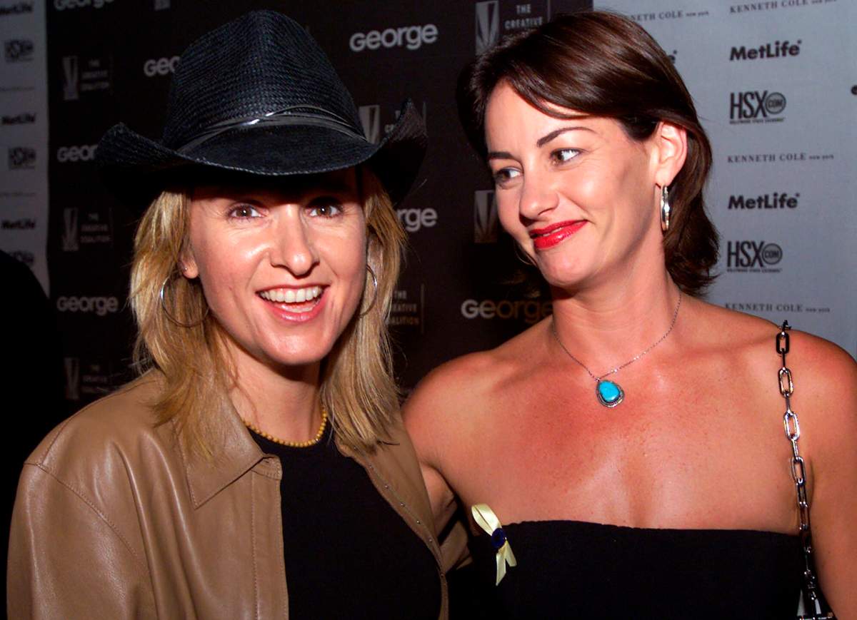 In this Aug. 16, 2000 file photo, Melissa Etheridge, left, and Julie Cypher arrive at a fundraiser for the Christopher Reeve Paralysis Foundation in Los Angeles, Calif.