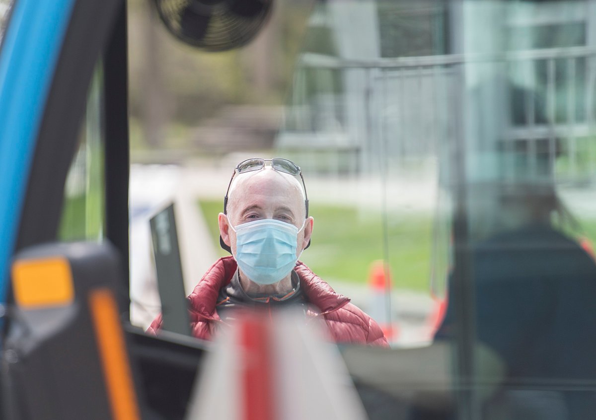 A man waits to be tested for COVID-19 at a mobile clinic in Montreal, Sunday, May 17, 2020, as the COVID-19 pandemic continues in Canada and around the world. 