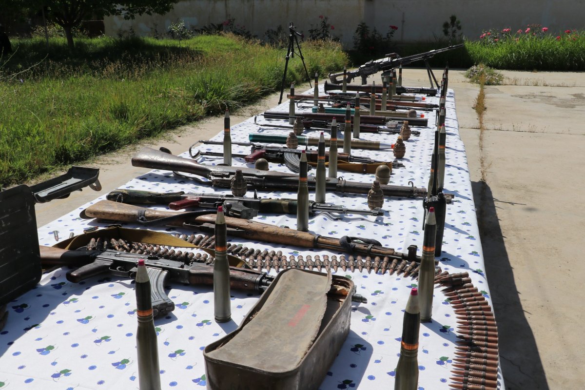 Photo taken on May 20, 2020 shows weapons handed over by Taliban militants during a surrender ceremony in Pul-e-Khumri, capital of Baghlan province, Afghanistan. Fifteen Taliban militants surrendered and handed over their weapons in Afghanistan's northern province of Baghlan on Wednesday. (Photo by Sahel/Xinhua) .