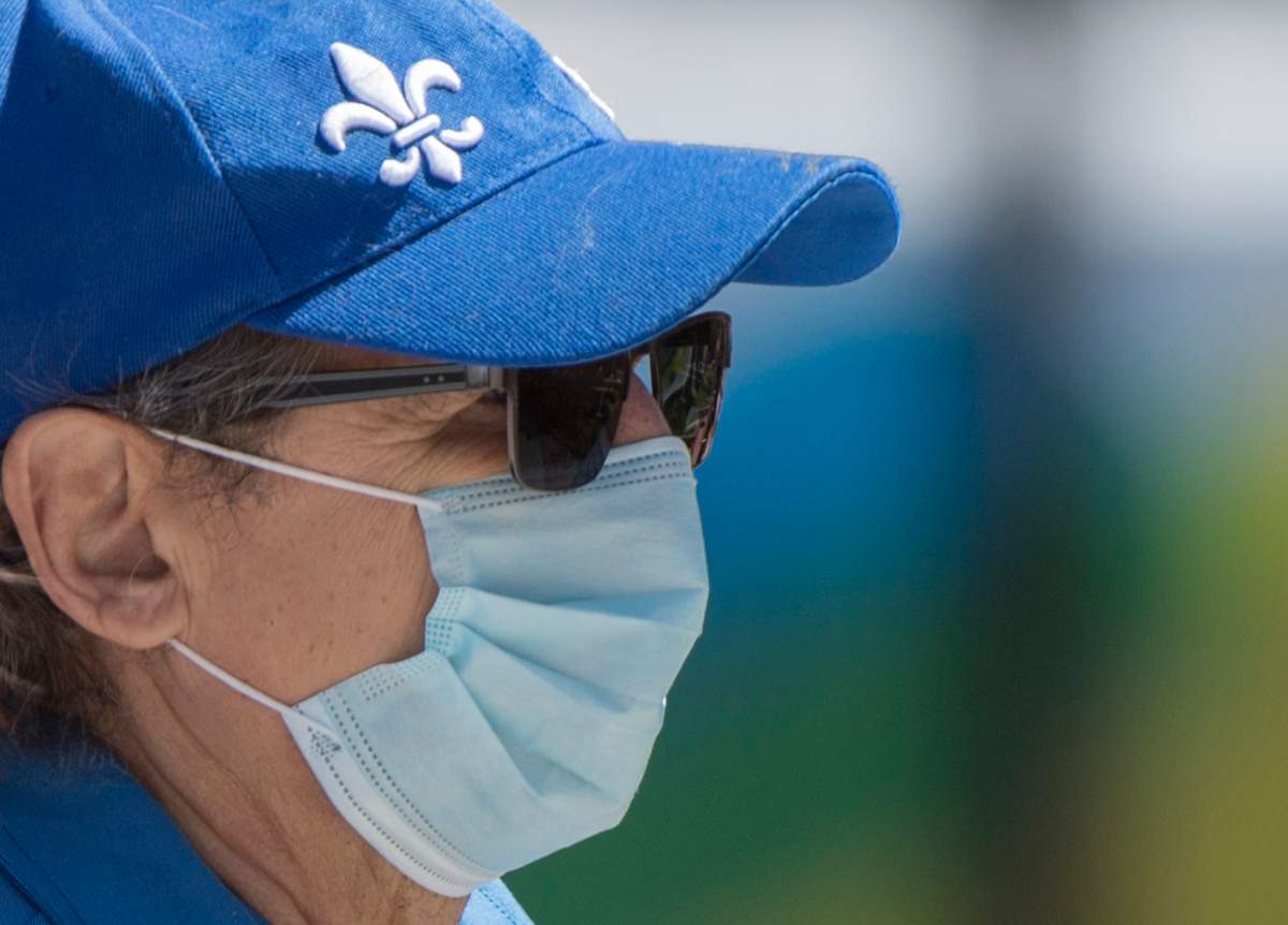 A person waits to be tested for the novel coronavirus at a mobile testing clinic in the Montreal neighbourhood of Verdun, Saturday, May 23, 2020.