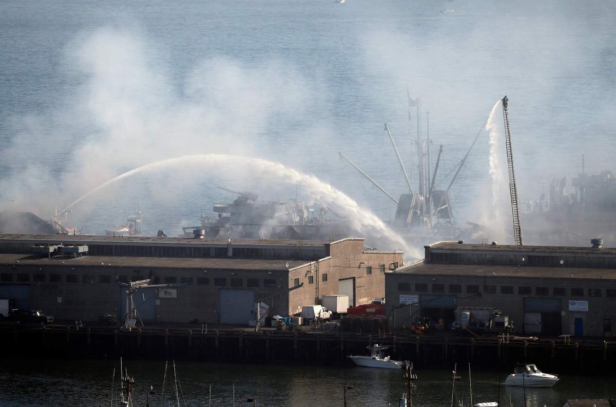 More than 100 San Francisco Firefighters battle a four-alarm fire on Pier 45 on Fisherman’s Wharf in San Francisco, California, May 23, 2020. Firefighters stationed a fireboat to protect the World War II-era SS Jeremiah O’Brien from any damage.