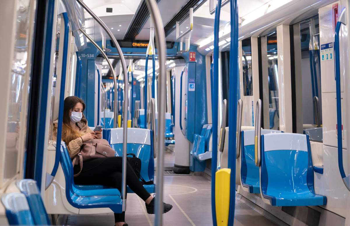 A commuter rides a near empty subway train in Montreal, on Monday, May 25, 2020. 