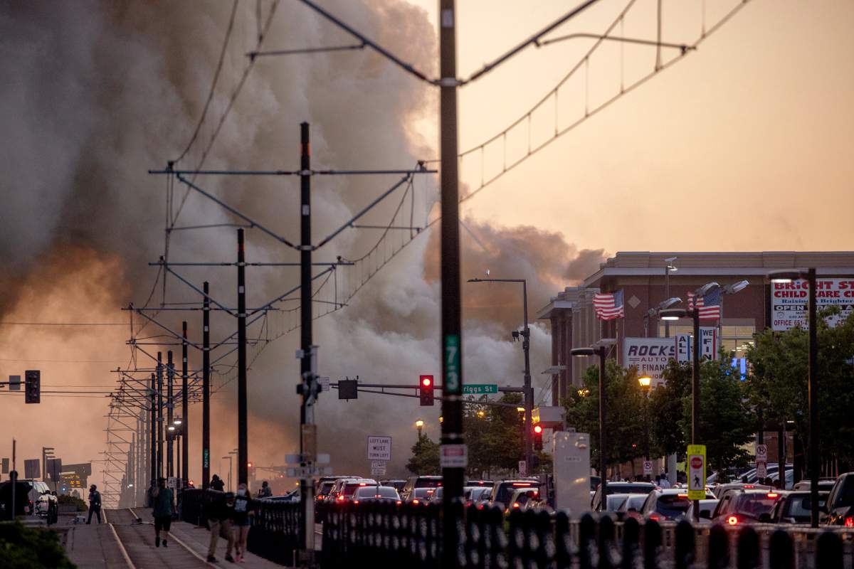 Smoke rises from fires as seen from University Avenue on Thursday, May 28, 2020, in St. Paul, Minn.Walz earlier Thursday activated the National Guard at the Minneapolis mayor’s request. The Guard tweeted minutes after the precinct burned that it had activated more than 500 soldiers across the metro area. A couple dozen Guard members, armed with assault-style rifles, blocked a street Friday morning near a Target store that has sustained heavy damage by looters.