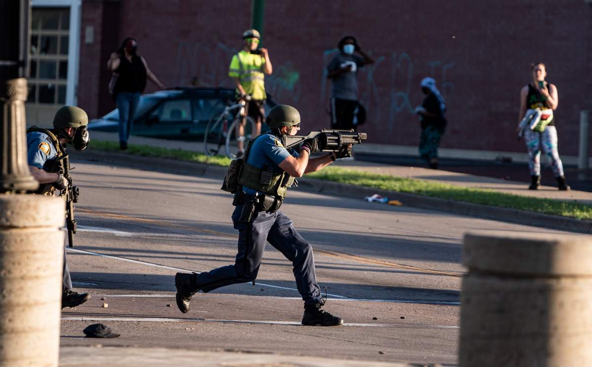 Police take control of the area near the Super Target against protesters Thursday, May 28, 2020, in St. Paul, Minn.