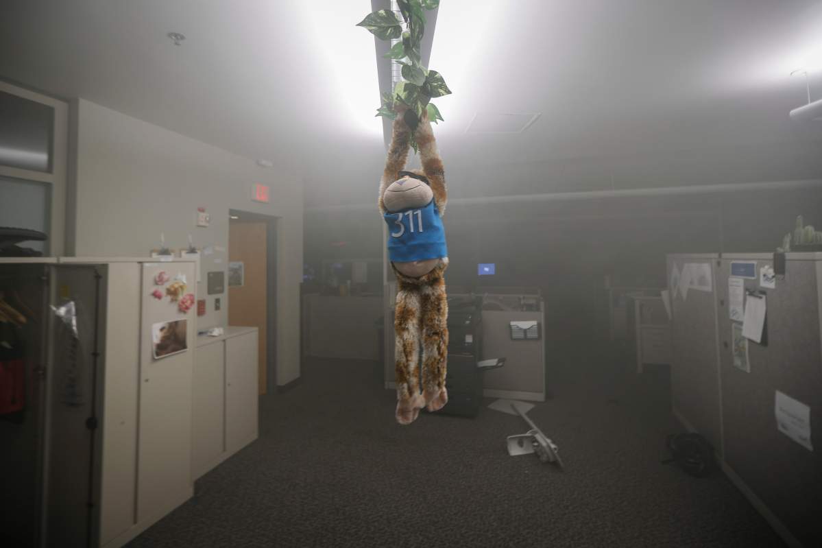 A stuffed toy hangs within the burning Minneapolis 3rd Police Precinct as smoke fills the room, Thursday, May 28, 2020, in Minneapolis. (AP Photo/John Minchillo)