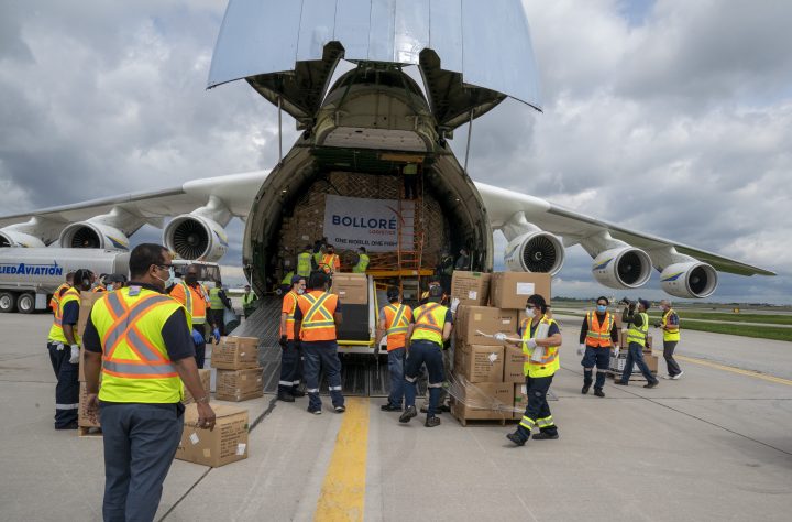 Workers unload the Antonov AN-225 after it arrived with medical supplies in Toronto on Saturday, May 30, 2020.