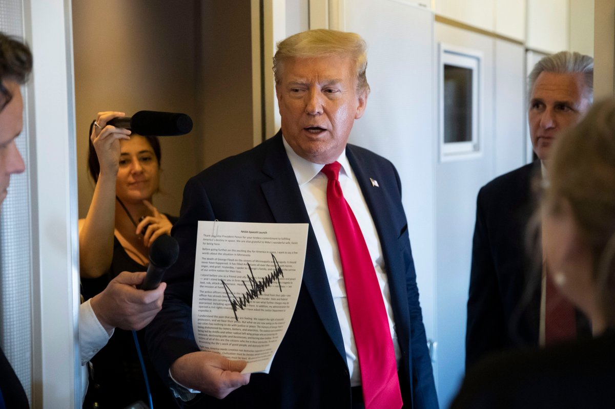 President Donald Trump, with House Minority Leader Kevin McCarthy of Calif., speaks with reporters while in air en route to Andrews Air Force Base Saturday, May 30, 2020, in flight. 