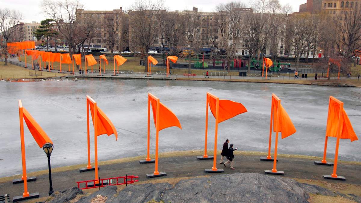 FILE – In this Feb. 12, 2005, file photo, pedestrians walk along the edge of Harlem Meer under “The Gates” project, by artists Christo and Jeanne-Claude, in New York’s Central Park. Christo, known for massive, ephemeral public arts projects, has died. His death was announced Sunday, May 31, 2020, on Twitter and the artist’s web page. He was 84.