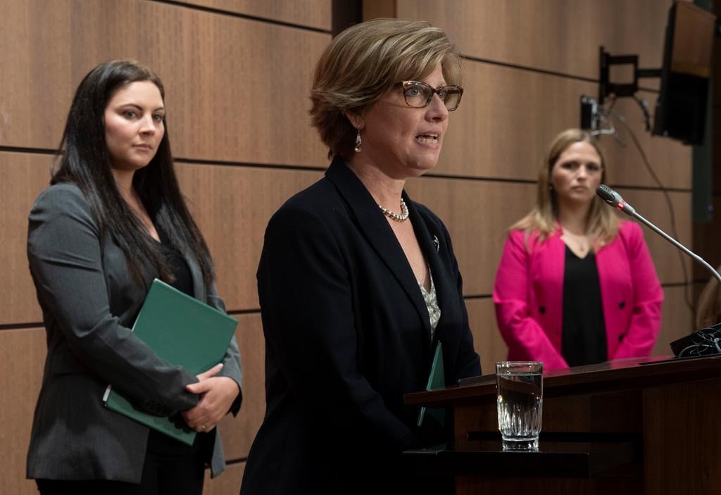 Green Party MP Jenica Atwin (left) and NDP Critic for Diversity and Inclusion and Youth, Women and Gender Equality Lindsay Mathyssen look on as Conservative Women and Gender Quality critic Karen Vecchio speaks during a news conference Thursday May 28, 2020 in Ottawa. THE CANADIAN PRESS/Adrian Wyld.