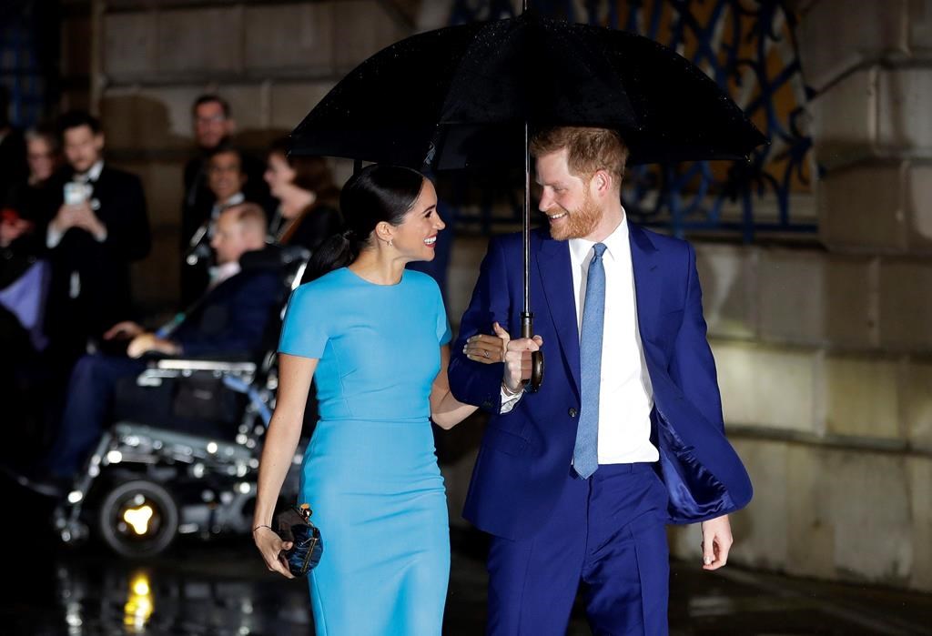 FILE - In this Thursday, March 5, 2020 file photo, Britain's Prince Harry and Meghan, the Duke and Duchess of Sussex arrive at the annual Endeavour Fund Awards in London.